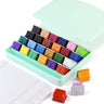 Fuumuui Ensemble de peinture gouache, 24 godets de couleurs individuelles vibrantes de 30 ml dans un étui de rangement vert menthe ouvert avec une palette de mélange blanche.