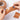 Hands tearing Fuumuui Watercolor Stretching Kraft Water-Activated Paper Tape, revealing its textured adhesive surface, with a roll of Fuumuui 45mm art supplies tape in the background.