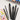 Fuumuui 6pcs Professional Squirrel Hair Mop Watercolor Brushes, featuring black handles, displayed next to a colorful watercolor painting and palette.