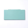 Mint green plastic travel palette case for watercolor and gouache paints. Portable, lightweight mixing tool for professional artists and beginners.