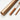 Professional Chinese Calligraphy Brush set featuring traditional bamboo handles with engraved characters and a textured bronze travel storage case for watercolor and ink artists.