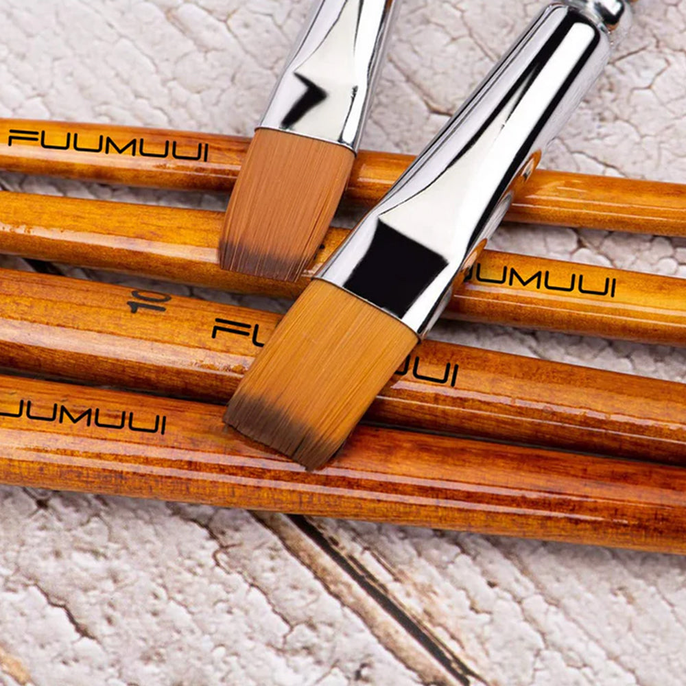 Fuumuui professional flat acrylic brushes with durable Japanese nylon hair on a wooden background.
