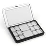Open portable metal travel palette for watercolor paint featuring 12 various sized silver pans and a large mixing area in the lid, perfect for professional artists and beginners.