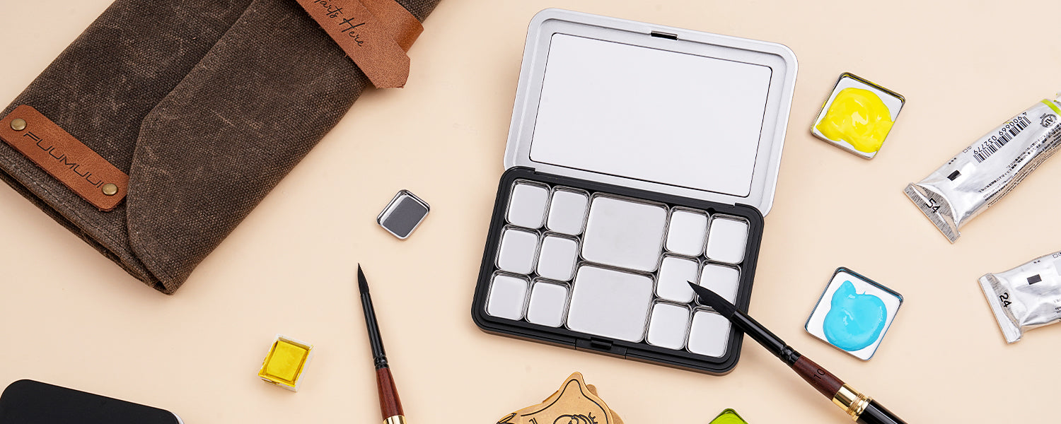 Fuumuui Art travel palette with empty pans, watercolor paint tubes, and a size 10 travel pocket brush. Includes a brown canvas roll and professional watercolor paint set tools for artists and beginners.