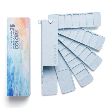 Fuumuui 26 Colors Solid Watercolor Paint Set with a light blue folding travel palette. Portable watercolor kit for beginners and professional artists sketching outside or painting indoors.