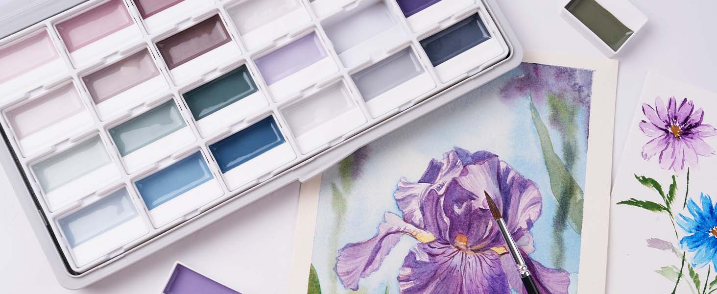 Fuumuui Art professional watercolor paint set with muted pigments, a pointed watercolor brush, and a floral iris painting on textured cold press watercolor paper for artists and beginners.