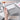 Holding open Fuumuui 24-well aluminum paint palette glacier silver in hand for outdoor painting.