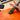 Professional artist using a Fuumuui FSC Squirrel Hair flat watercolor brush to apply an orange wash on 100% cotton cold press paper. Features a watercolor paint set and pigment pans for professional results.