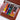 Portable Travel Palette and Watercolor Paint Set with vibrant pigments clipped into a brown leather sketchbook. Ideal compact watercolor kit for professional artists and beginners sketching on the go.