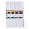 Open portable tin revealing the FUUMUUI 36-color half-pan solid watercolor paint set.