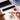 Fuumuui professional calligraphy brush painting vibrant watercolor flowers with red ink, surrounded by an ink stone and traditional dragon water pot for ink painting.