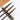 Fuumuui professional calligraphy brushes with dark bamboo section handles, suitable for watercolor, resting on a green jade brush rest.