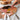 Fuumuui professional artist using a flexible palette knife from an oil paint brush set to mix acrylic paints on a wooden palette for canvas painting.