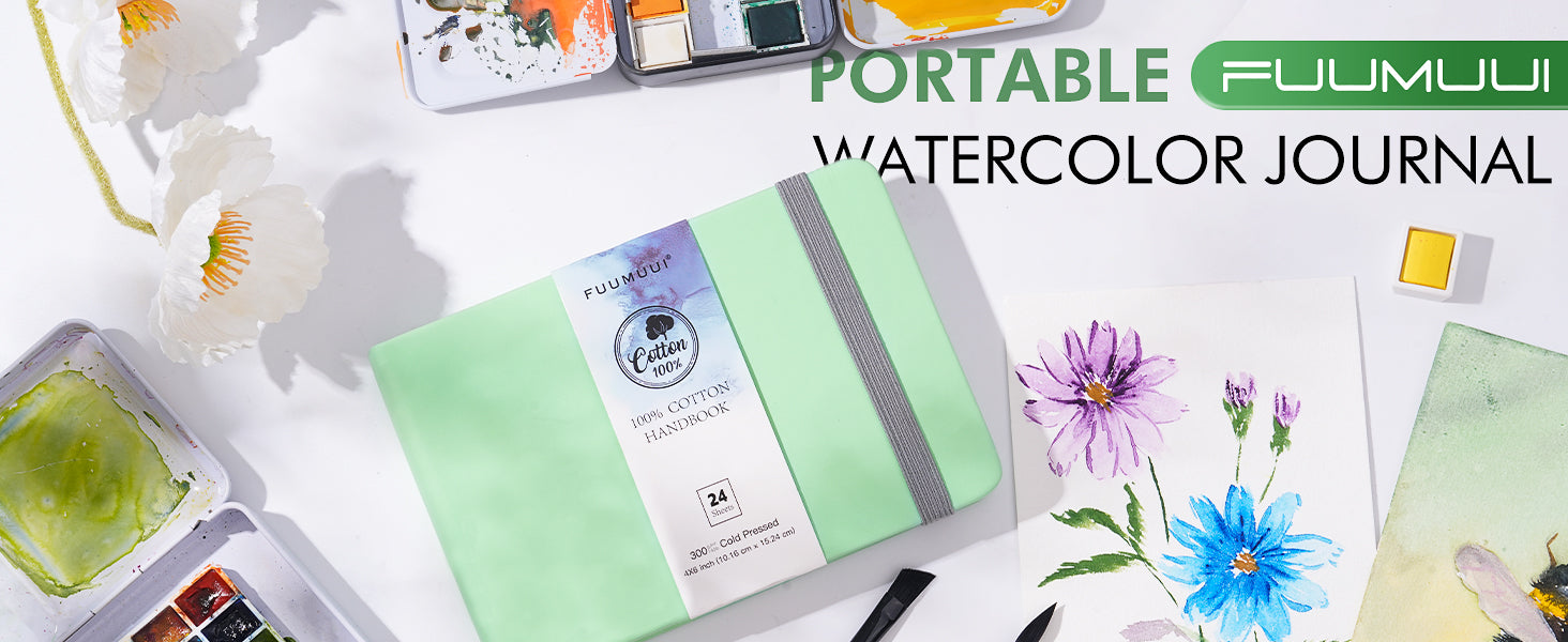Portable Fuumuui Watercolor Journal with 24 sheets of 100% Cotton Cold Press 300gsm paper. Mint green travel sketchbook shown with a watercolor paint set and floral illustrations for professional artists and beginners.