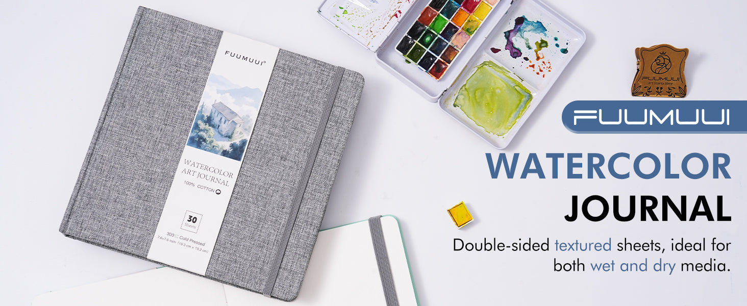 Square 100% Cotton Watercolor Art Journal, 300gsm Cold Press paper sketchbook for professional artists and beginners. 30 double-sided textured sheets shown with a travel watercolor paint set and mixing palette.