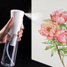 Fuumuui High-Pressure Spray Bottle held in hand, powerfully spraying a fine, continuous mist.