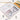 Fuumuui 24-Color Opaque Semi-Solid Watercolor Paint Set featuring muted colors, displayed open in its white metal case with removable pans, alongside a watercolor sketchbook. This Fuumuui art supply is ideal for beginners and artists.