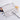 Fuumuui Art Supplies Airtight Plastic Paint Palette with Lid, 24 Wells for Watercolor & Acrylic. White palette shown open with a Fuumuui paintbrush and paint samples.