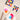 Fuumuui Art Supplies: Ceramic watercolor palettes, including a 12-well and 20-well porcelain paint mixing tray, with vibrant paints and mixed watercolors, alongside brushes for artists' studio or travel.