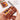 Fuumuui Premium Wood Watercolor Set with 15 handpicked colors and built-in mixing palette, held to show its compact, portable design.