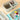 Fuumuui 3 Pack multi-use paint brush tub, washer, cleaner, and holder, filled with water and brushes, next to an 18-well palette displaying vibrant watercolor, oil, acrylic, and gouache paints for indoor outdoor artistic use.