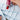 Squeezing Madder Lake Pigment PR122 from a tube of Artists' Transparent Watercolor Paint into a speckled blue travel palette well. Professional art supplies for watercolor artists and beginners.