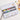 Fuumuui watercolor set open on a desk with paint droplets in mixing wells, a paintbrush, and watercolor art.