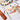 Professional artist using a Fuumuui Kolinsky Sable Travel Watercolor Brush to paint. Set features silver metal travel pocket brushes, a leather case, and a watercolor paint set palette for beginners and pros.