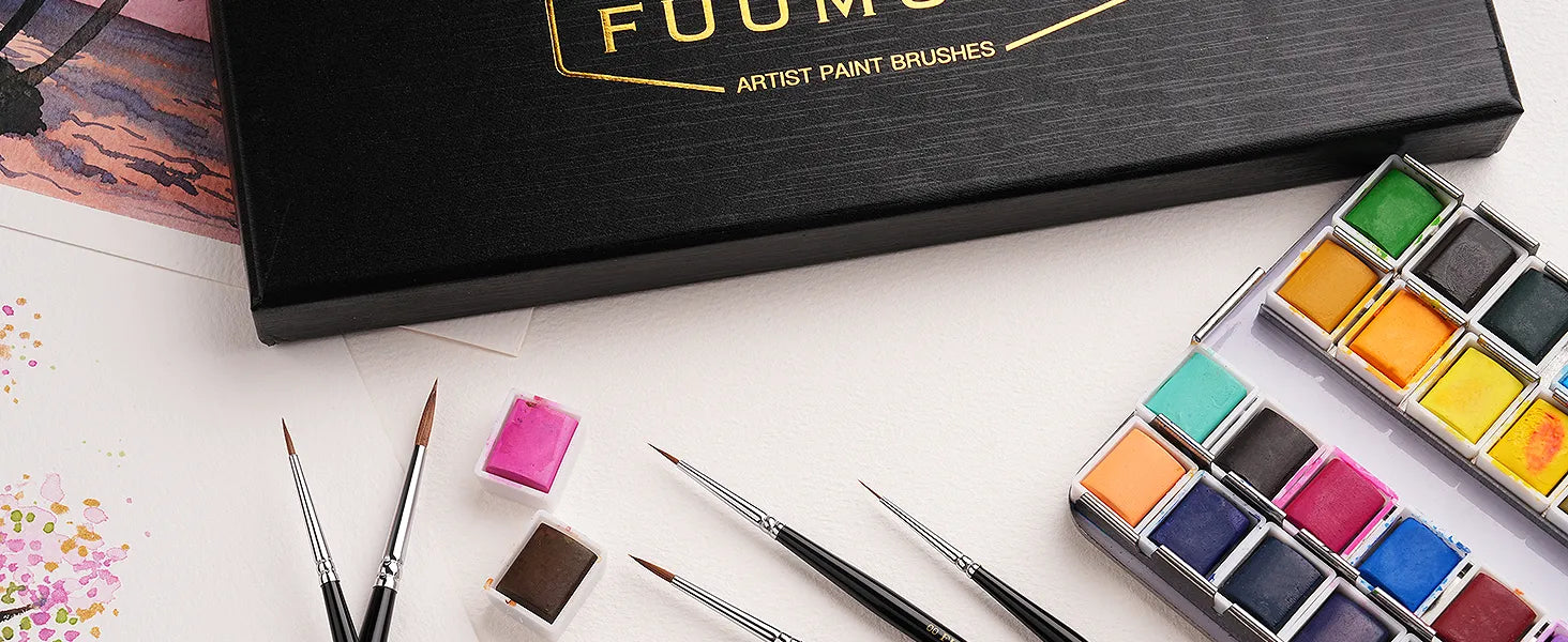 Fuumuui 5pcs professional Kolinsky Sable detail brushes and miniature paint brush set on cold press watercolor paper with a vibrant watercolor paint set and individual pigment pans for professional artists.