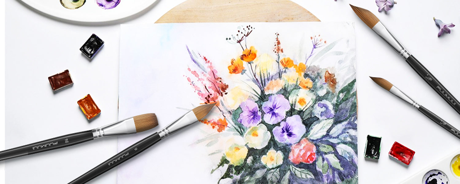 Fuumuui Professional Kolinsky Sable Watercolor Brush set featuring Cat’s Tongue, Flat, and Dagger Stripper shapes. Shown with a floral watercolor painting on cold press paper, ceramic palette, and watercolor paint pans.