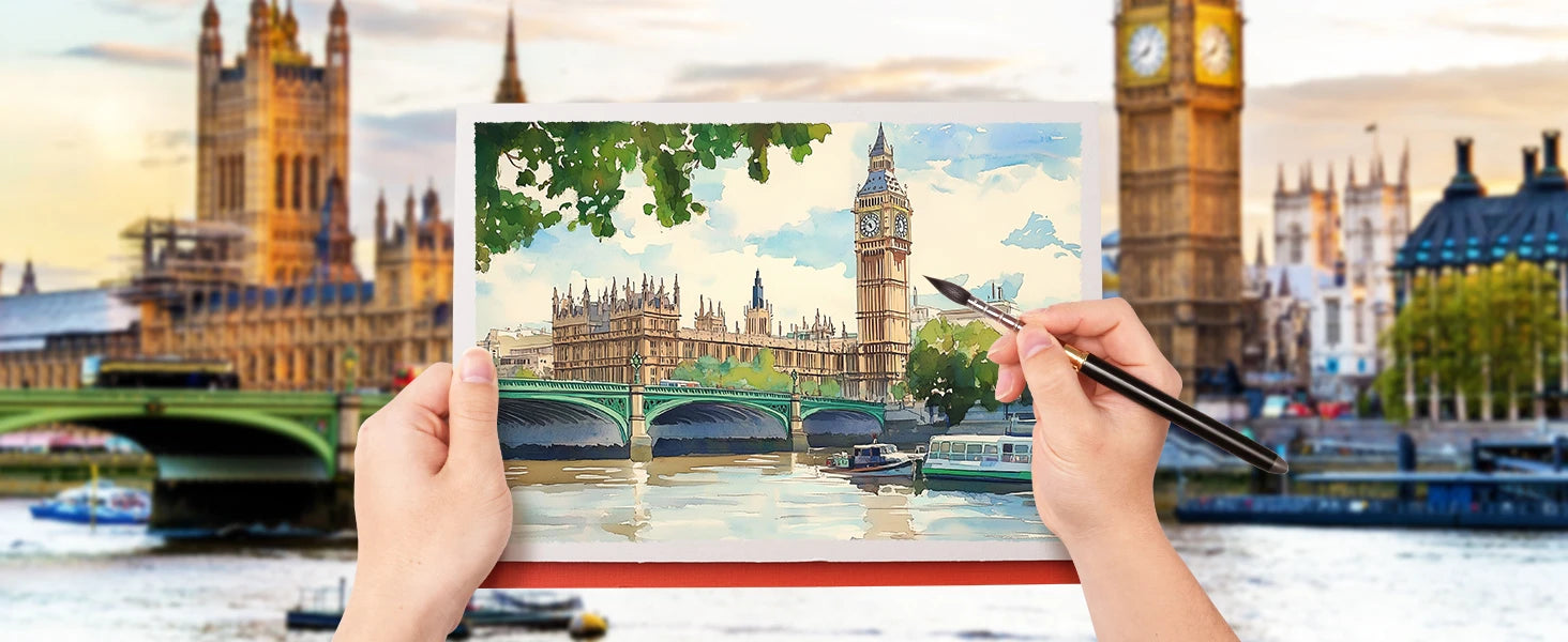 Professional artist using a pure Squirrel Hair Travel Watercolor Brush to paint a London landscape on a watercolor block. High-grade travel pocket brush for urban sketching and watercolor painting.