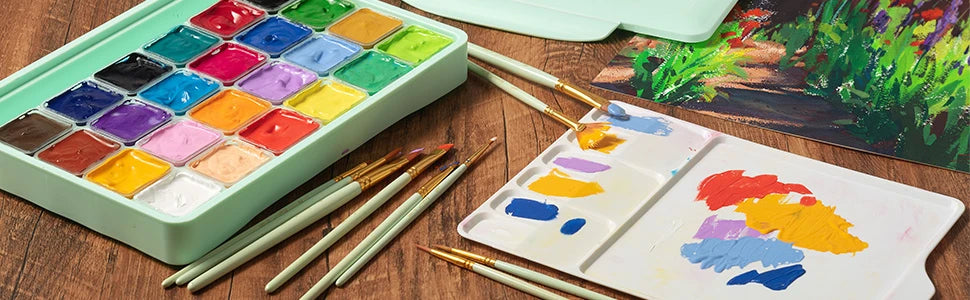 Fuumuui 24 colors gouache paint set with 30ml cups, synthetic nylon brushes, and a plastic palette. High pigment non-toxic gouache for professional artists and beginners creating vibrant, opaque gouache paintings.
