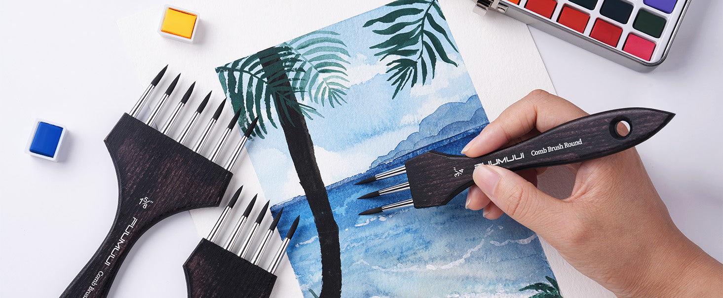 Fuumuui Multi-Head Synthetic Nylon Comb Brush Round in 3/4 and 1 5/8 inch sizes for textures. Artist painting palm tree details on cold press watercolor paper with a watercolor paint set and metal palette.