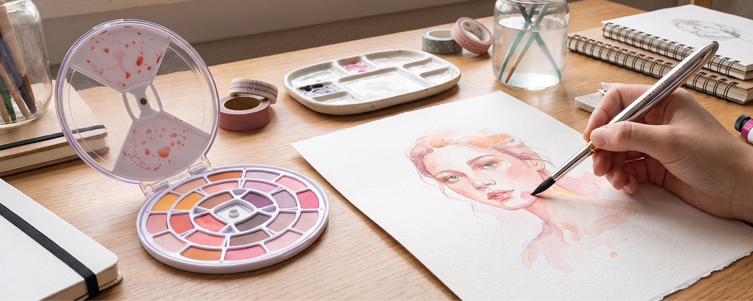 Artist painting watercolor portrait using the Fuumuui 24 portrait watercolor set.