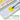 A paintbrush mixing yellow paint on the white lid of a mint green palette, labeled as a built-in mixing surface.