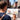 Artist using Fuumuui Kolinsky sable travel watercolor brush for plein air painting an urban landscape.