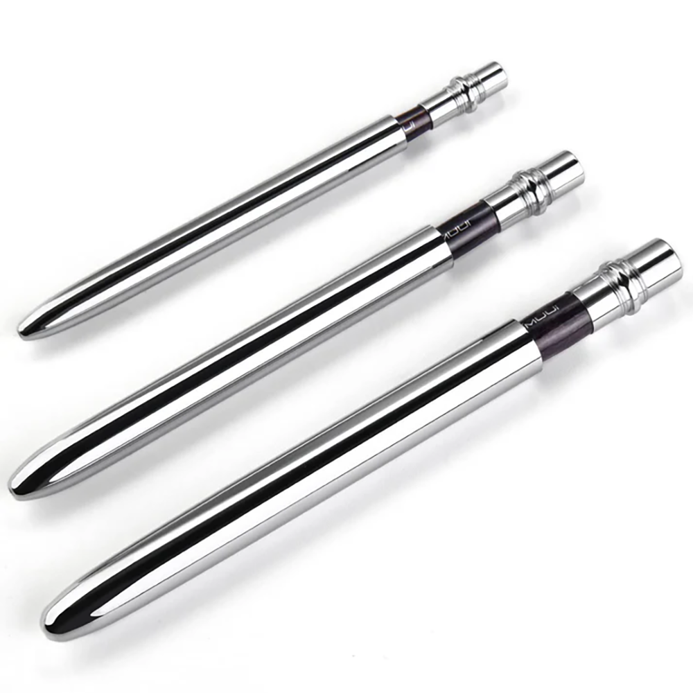 A full set of three professional retractable travel brushes in varying sizes with their sleek metal caps attached.
