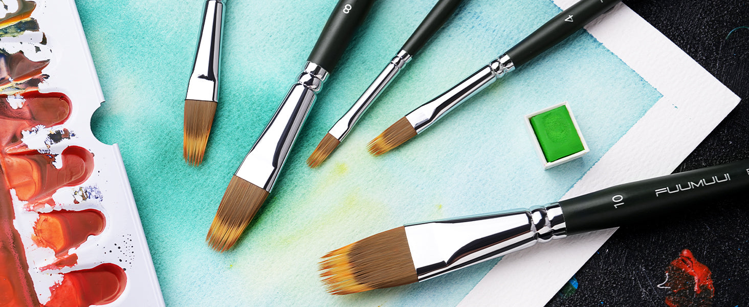 Fuumuui flat synthetic nylon watercolor brushes in sizes 4, 8, and 10 on textured cold press paper. Professional artist tools shown with a plastic palette and green watercolor pigment pan for beginners and pros.