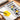 Mixing yellow watercolor paint on ceramic white surface of Fuumuui 24-well aluminum palette glacier silver.