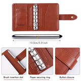 Fuumuui Art Supplies Watercolor Travel Set showing the open brown PU leather cover with refillable ring-bound design, dedicated brush insertion slot, secure button closure, and the silver double-ended travel brush.