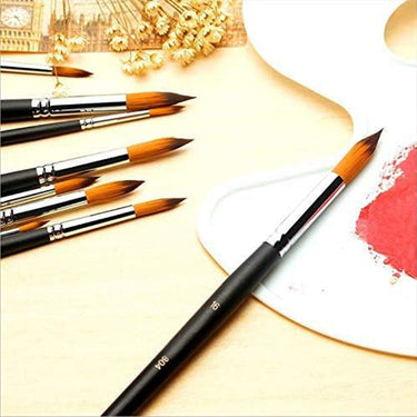 Fuumuui 9pcs professional nylon hair acrylic brushes with round pointed tips, shown with red paint on a palette.