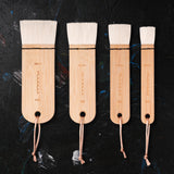 Fuumuui 4pcs Wool Watercolor Brushes set with extra soft, high absorption flat wash brushes in 50mm, 40mm, 30mm, and 20mm sizes, perfect for washes, backgrounds, and large area painting.