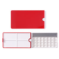 Fuumuui 28-Well Travel Watercolor Palette with its compact design, 360° rotating red lid, four mixing trays, 28 empty paint wells, and brush slot.