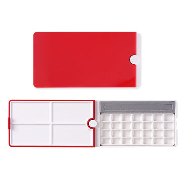 Fuumuui 28-Well Travel Watercolor Palette with its compact design, 360° rotating red lid, four mixing trays, 28 empty paint wells, and brush slot.
