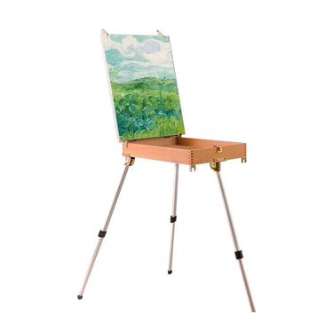 Fuumuui Sketche Box Easel with Aluminum Tripod, open drawer, and a landscape painting on canvas