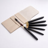 Fuumuui 6pcs High-Grade Pure Squirrel Hair Travel Watercolor Brushes with black handles and gold ferrules in a light beige case.