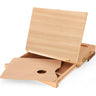 Fuumuui wooden table sketch box easel open, revealing the storage drawer and included wood artist's palette partially pulled out.