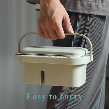 Fuumuui portable multi-use paint brush tub with handle and lid, a brush washer, cleaner, and holder carried by hand.