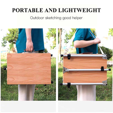 Chevalet de table portable en bois Fuumuui porté à la main et avec une bandoulière, soulignant sa conception légère pour le croquis en plein air.