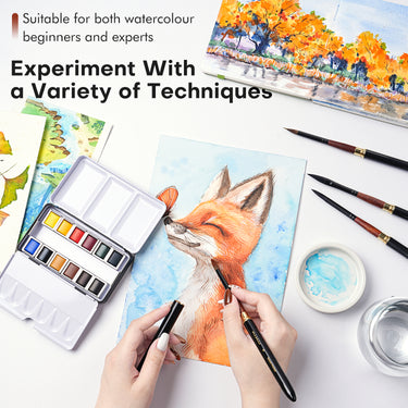 Fuumuui Travel Watercolor Set with 12 vibrant watercolors, travel brush, and palette, used by an artist painting a fox; perfect for beginners and experts.